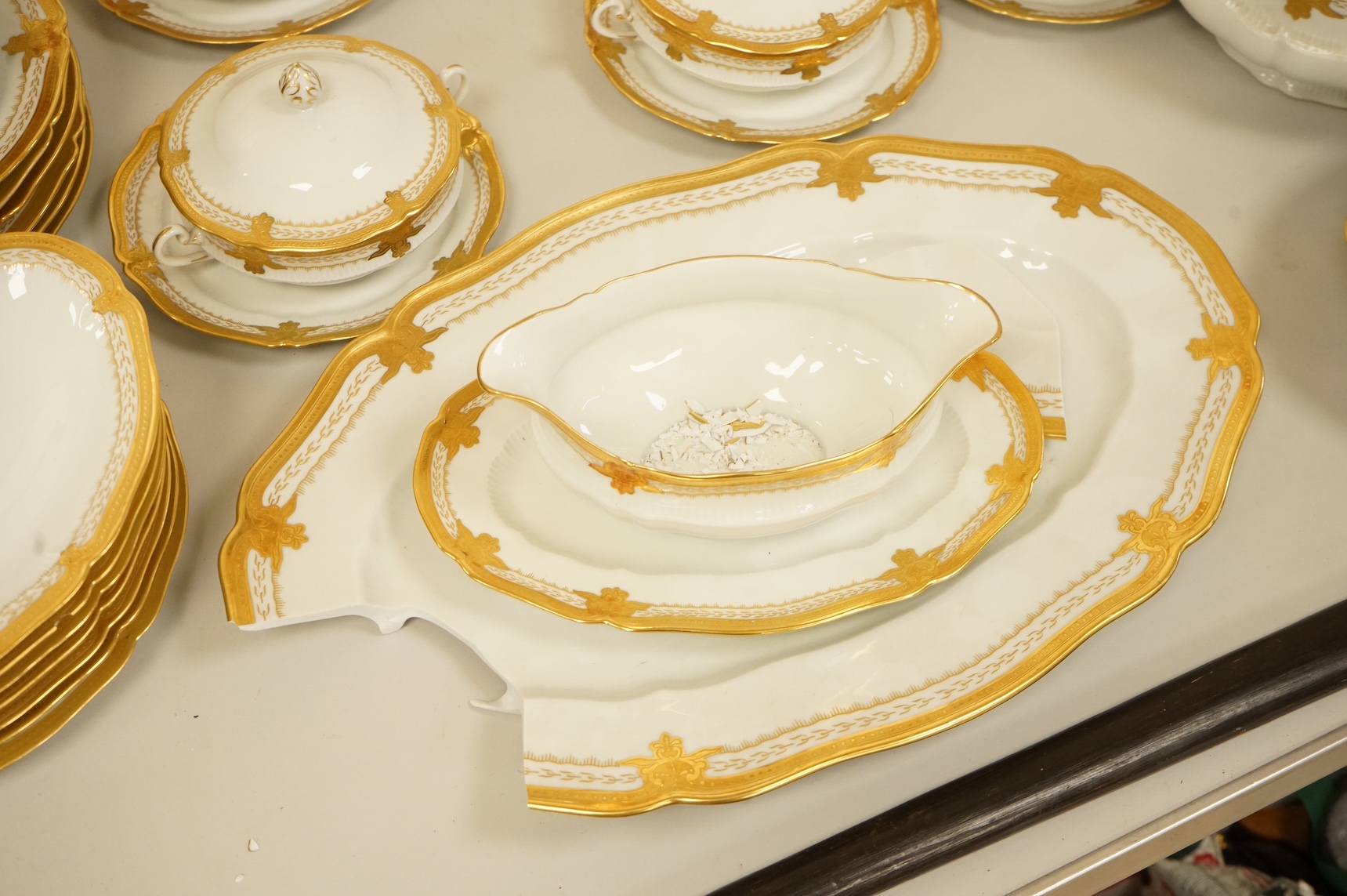 A Haviland Limoges dinner service with gilt border